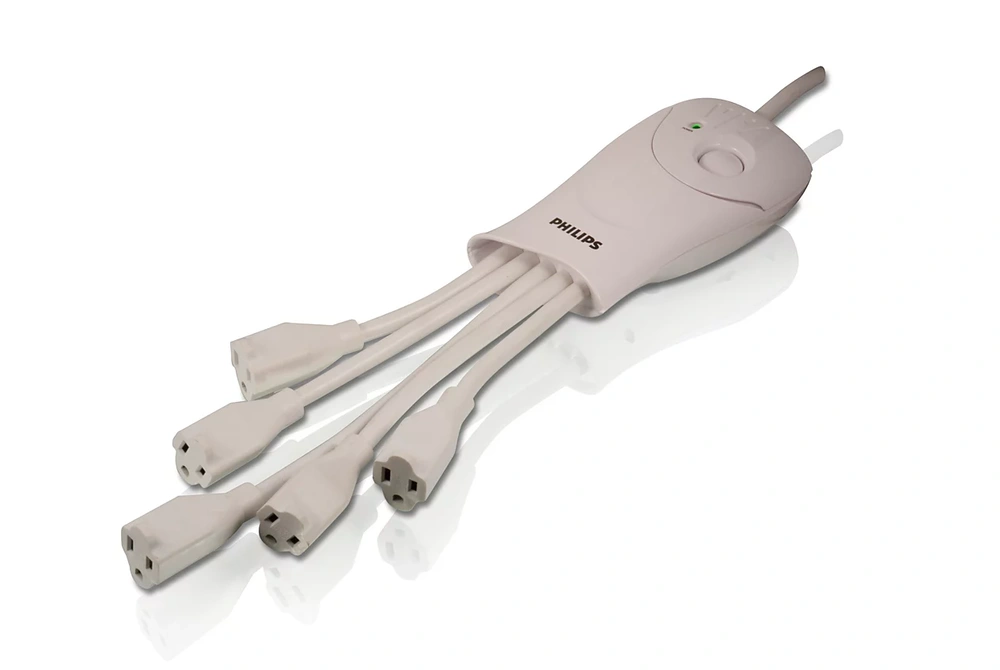 A white Philips power strip with five angled outlets on short cords
